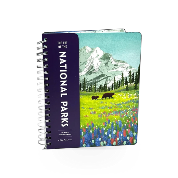 National Parks Planner book by Simon & Schuster featuring a colorful cover with scenic park images and planning pages.