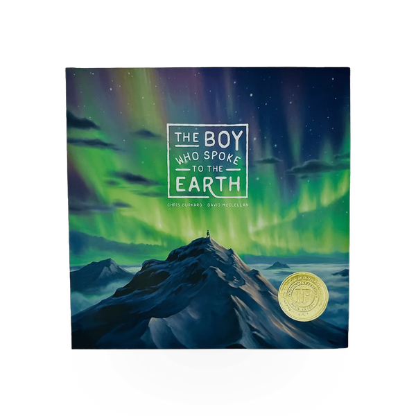 Open copy of "The Boy Who Spoke To The Earth" by Dreamling Books, showing the front cover with colorful illustrations.
