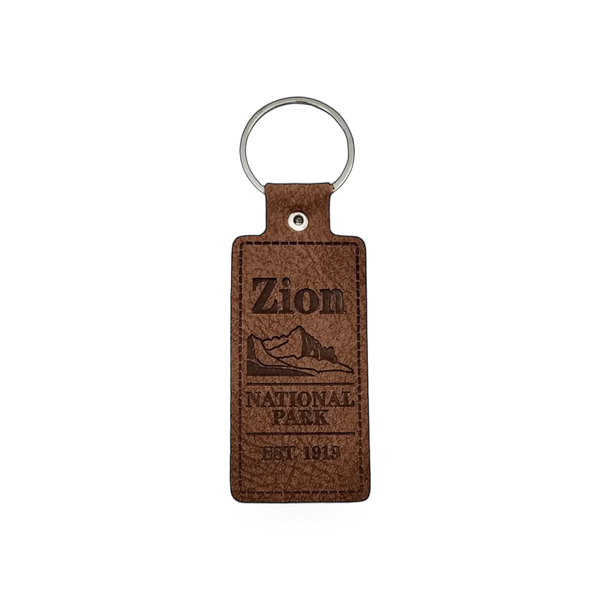 Leather keychain featuring a Field Notes design from Impact Photographics, with embossed branding and a metal keyring.