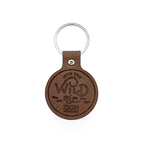 Leather Into The Wild keychain by Impact Photographics, featuring a detailed wilderness design on a leather charm.