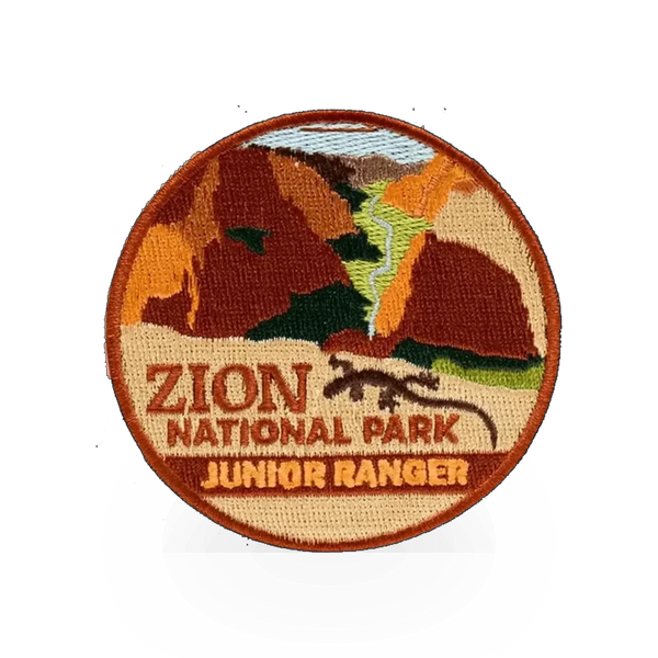 Eagle River Designs Junior Ranger theme patch featuring a colorful embroidered design on a fabric background.