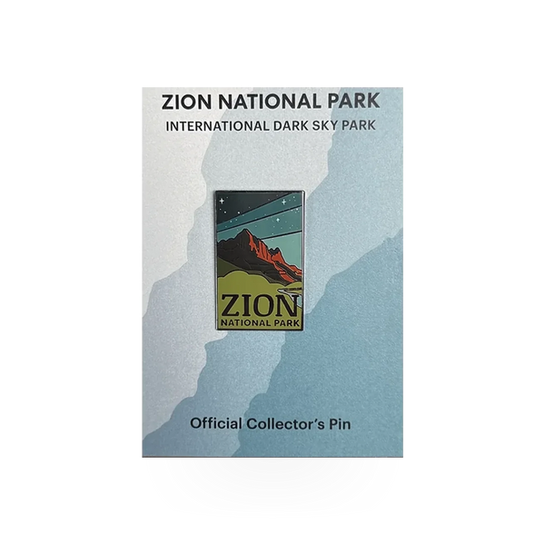 Eagle River Designs Zion National Park Dark Sky theme pin featuring a night sky scene and park landscape.