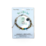Phillips International Inc. Tree Mission bracelet featuring a detailed tree charm on a simple metal band.
