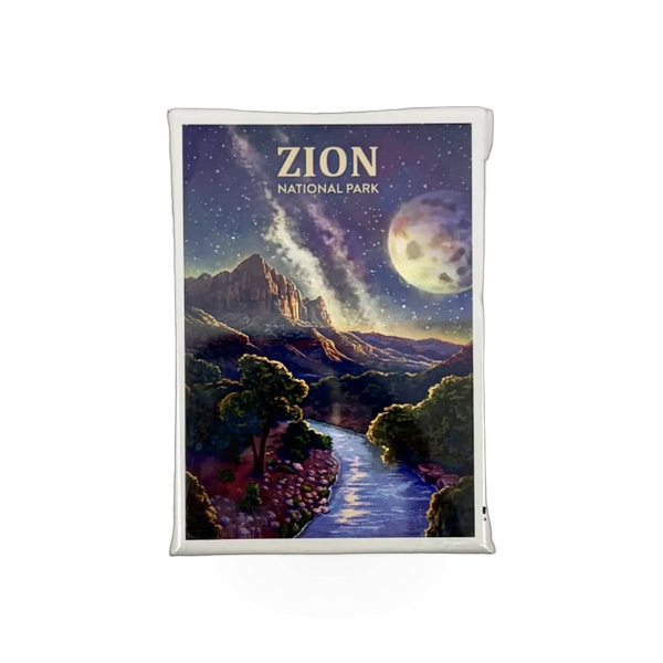 Lantern Press Watchman Milky Way magnet badge with a celestial galaxy design on a metal surface.