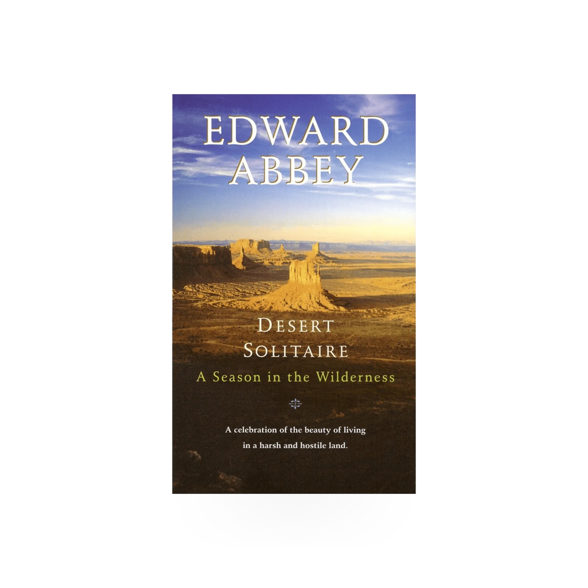 Desert Solitaire book by Penguin Random House, open pages showing text and desert landscape illustration on cover.