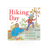 Simon & Schuster Hiking Day book, a paperback travel guide with scenic outdoor illustrations and hiking tips.