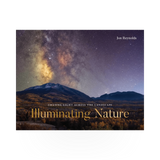 Open book titled "Illuminating Nature" by W.W. Norton showing detailed nature photographs and informative text pages.