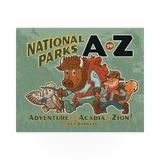 Open book titled "National Parks A to Z" by Mountaineers Books, showing colorful pages and park illustrations.