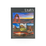 Open book titled Utah's Natl Parks Journey by Park Partners, featuring scenic images of Utah's national parks on the pages.