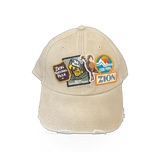 American Needle Zion Iconic Patches khaki hat with embroidered patches and adjustable strap, casual streetwear style.
