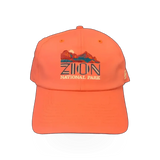 American Needle Zion Ripstop hat in vibrant red and orange with a stylish theme design and adjustable strap.
