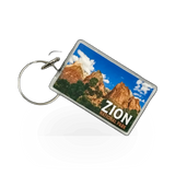 Impact Photographics keychain with a compass design, featuring various colorful compass images on a metal keychain.