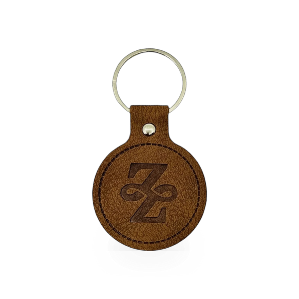 Leather keychain with ZFP logo by Impact Photographics, featuring a sleek design and metal keyring attachment.
