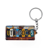 Impact Photographics Utah Rocks License keychain featuring a scenic Utah rock formation design.