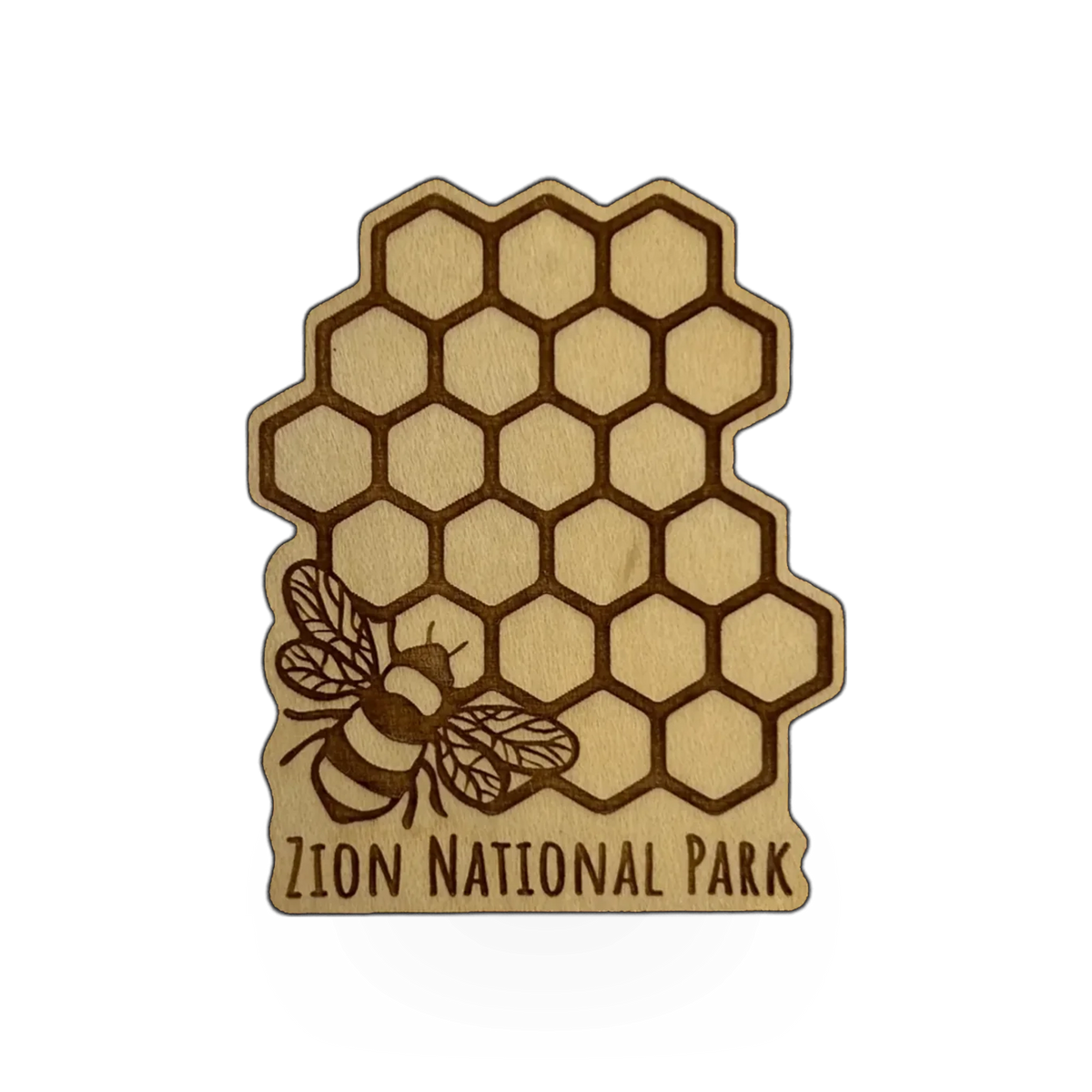 Steamer Lane Design wood honeycomb and bee magnet featuring Zion design, with detailed honeycomb pattern and bee illustration.