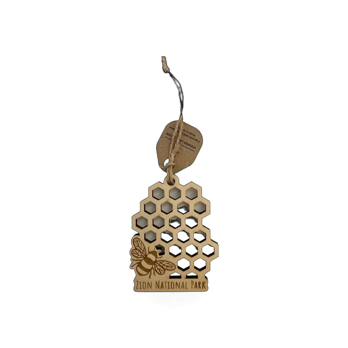 Wood ornament featuring a honeycomb pattern and bee design from Steamer Lane Design's Zion collection.