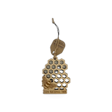 Wood ornament featuring a honeycomb pattern and bee design from Steamer Lane Design's Zion collection.