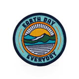 Outpatch Earth Day themed patch featuring a colorful Earth design on fabric, suitable for eco-friendly projects and clothing.
