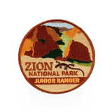 Eagle River Designs Junior Ranger theme patch featuring a colorful embroidered design on a fabric background.