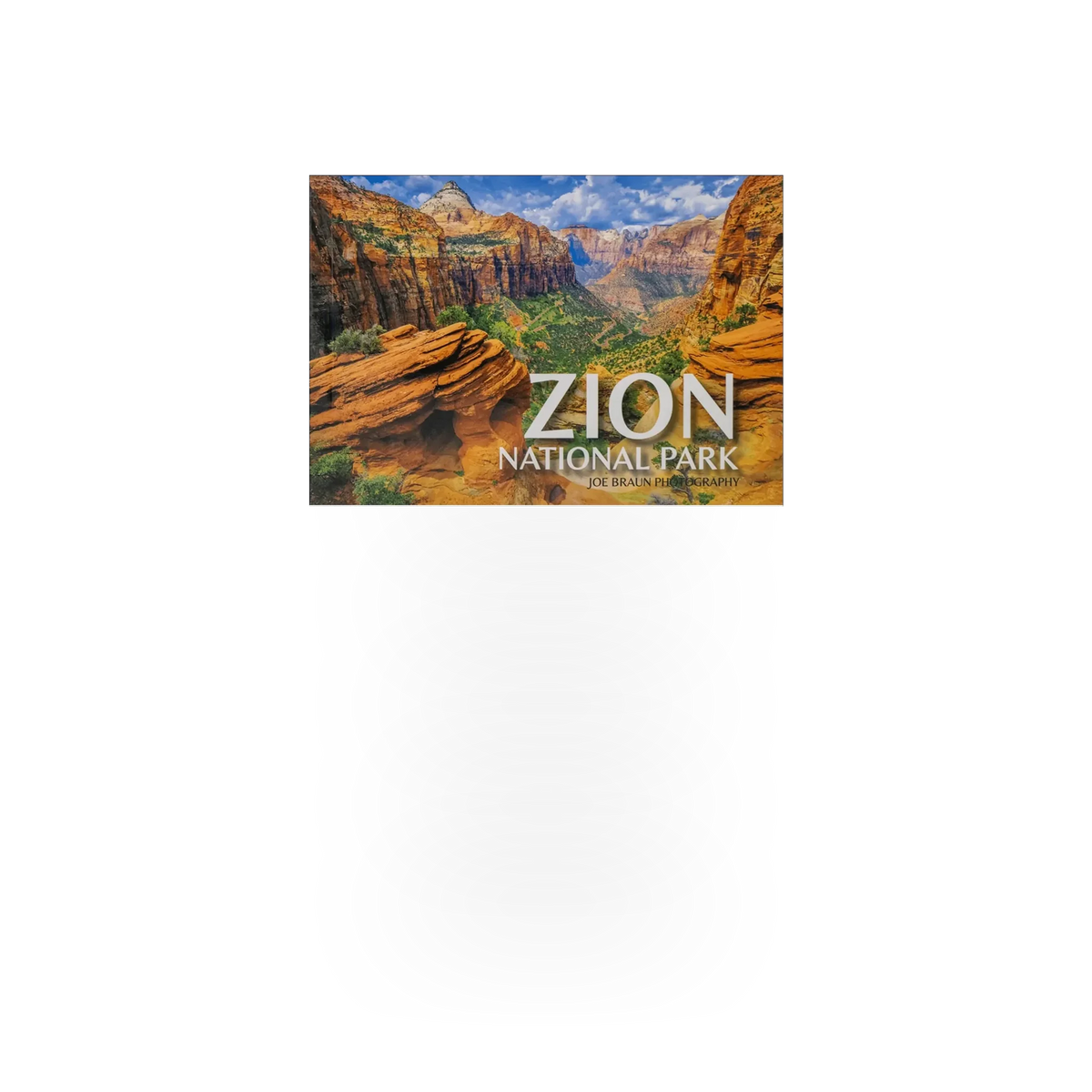 Postcard book featuring Zion National Park scenes by Park Partners, with colorful landscape images and compact design.