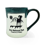 Americaware Zion Bighorn theme mug with mountain and wildlife design on ceramic surface, ideal for coffee or tea.