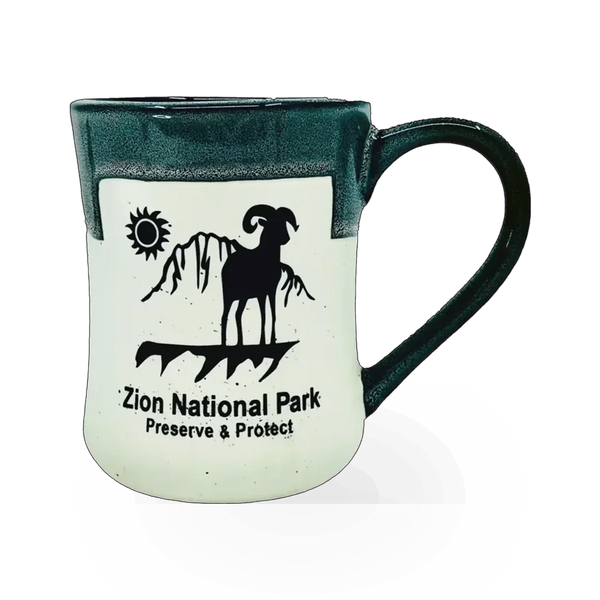Americaware Zion Bighorn theme mug with mountain and wildlife design on ceramic surface, ideal for coffee or tea.